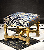 A very rare set of four Louis XIV carved gilt tabourets